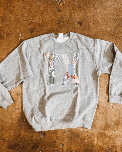 State Patchwork Sweatshirt – Oversized Letter Appliqué